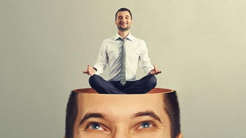 man looking up at calm yoga man