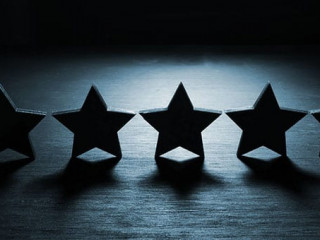 Five stars in the dark. Customer experience and satisfaction concept.
