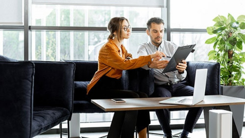 Young family having some business at the bank office