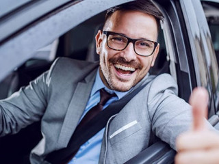 Handsome caucasian unshaven classy businessman in suit and with