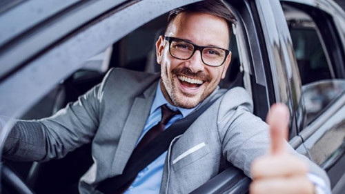 Handsome caucasian unshaven classy businessman in suit and with