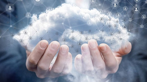 A businesswoman holding a cloud with network connections.