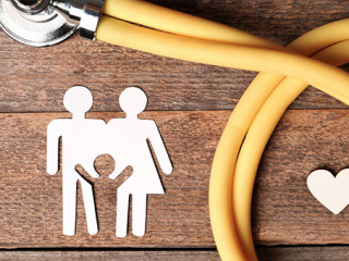 Flat lay composition with heart, stethoscope and paper silhouett