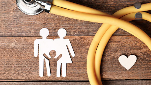 Flat lay composition with heart, stethoscope and paper silhouett