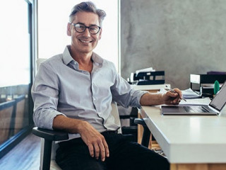 Mid adult businessman at work