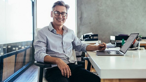 Mid adult businessman at work