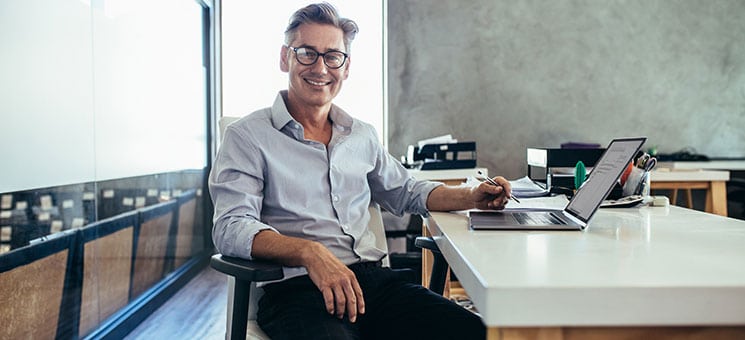 Mid adult businessman at work