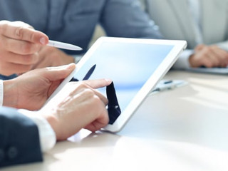 Business adviser analyzing financial figures denoting the progre