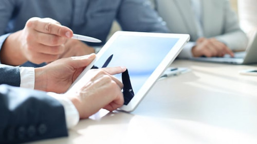 Business adviser analyzing financial figures denoting the progre