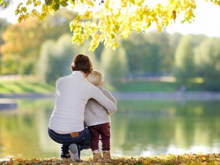 Woman and her toddler son in park