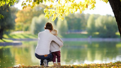 Woman and her toddler son in park