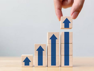 Ladder career path for business growth success process concept.Hand arranging wood block stacking as step stair with arrow up