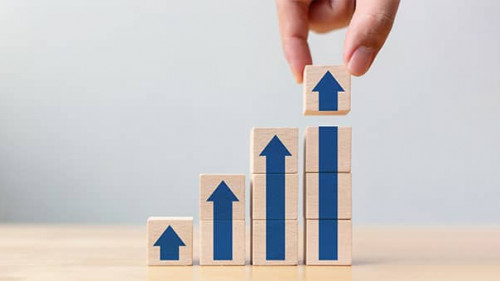 Ladder career path for business growth success process concept.Hand arranging wood block stacking as step stair with arrow up