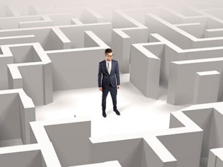 Businessman standing in a middle of a maze