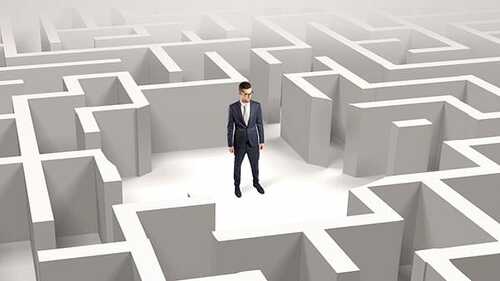 Businessman standing in a middle of a maze