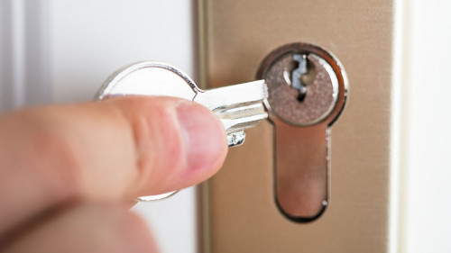 Hand Holding Broken Key