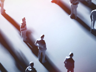 Two groups of people separated by blank space.