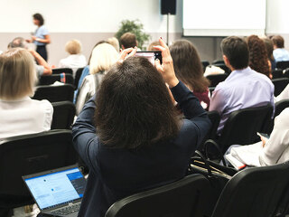 Business woman and people Listening on The Conference. Horizontal Image