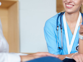 Female doctor hand hold silver pen filling patient history list at clipboard pad