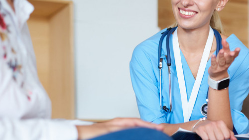 Female doctor hand hold silver pen filling patient history list at clipboard pad