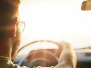 Young man driving his car