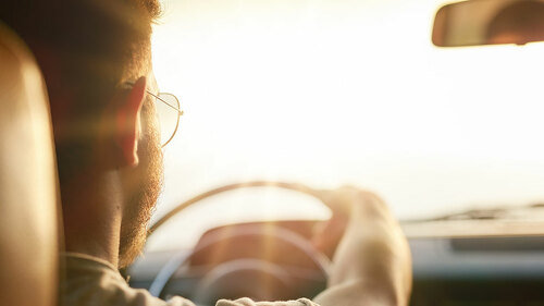 Young man driving his car