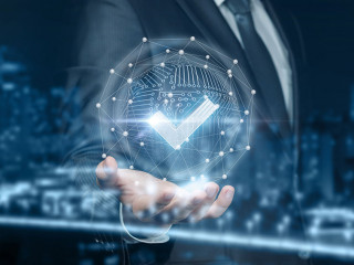 A businessman shows sign quality system .