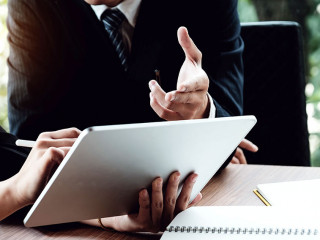 Business woman and lawyers discussing and using digital tablet