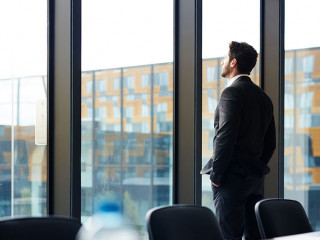 Successful Businessman by Window