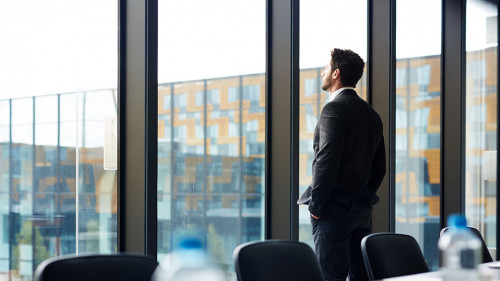 Successful Businessman by Window