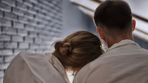 couple in love at home view from the back, man and woman relatio