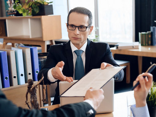 3339313 Serious lawyer gives adult man to sign document on divor