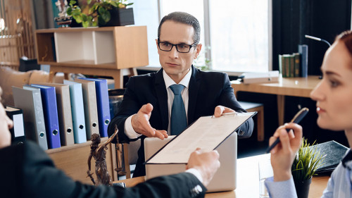 3339313 Serious lawyer gives adult man to sign document on divor