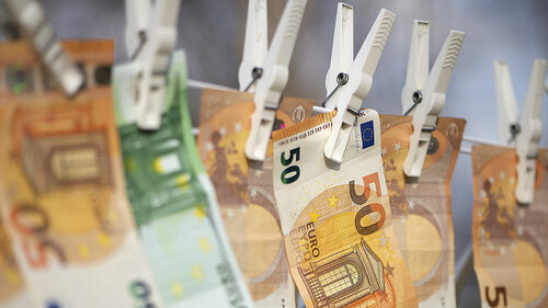 100 and 50 euro banknotes drying. Washed Euro paper bills. Dryin