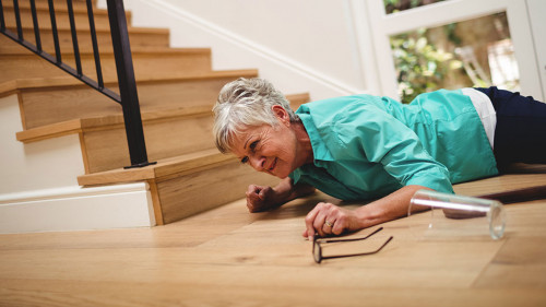 Senior woman fallen down from stairs