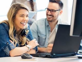 Group of business people and software developers working as a te