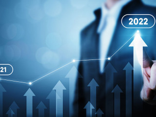 Businessman pointing arrow graph corporate future growth plan. Business development to success and growing growth year 2021 to 2022 concept