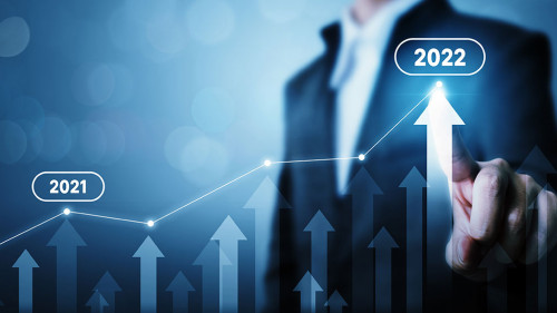 Businessman pointing arrow graph corporate future growth plan. Business development to success and growing growth year 2021 to 2022 concept