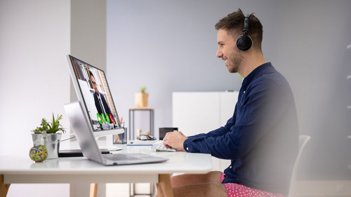 Businessman Attending Video Conference On Computer