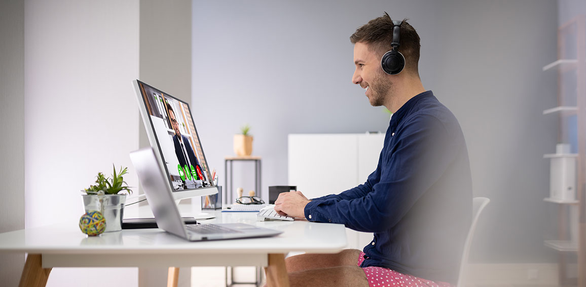 Businessman Attending Video Conference On Computer