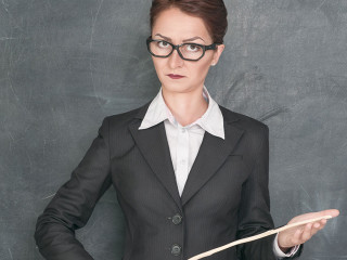Strict teacher with wooden stick