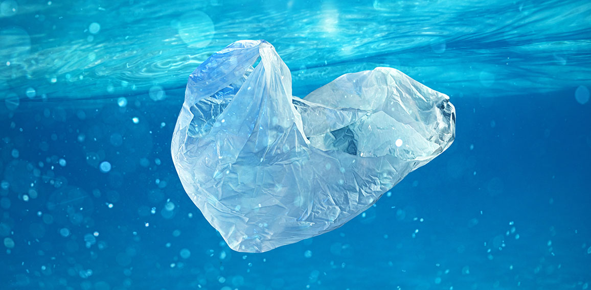 Floating bag. Problem of plastic pollution under the sea concept.