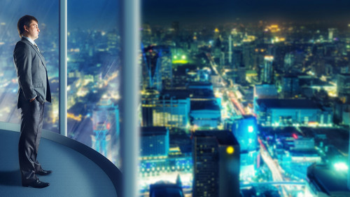 Businessman staying infront of city view