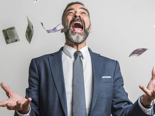 Excited senior business man throwing money, euro bills, in the a