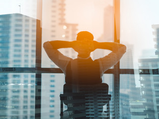 Portrait of relaxed businessman in modern office.Business young