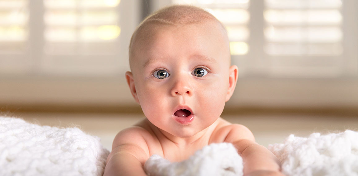 Surprised funny expression cute puffy chubby cheeks big blue eye