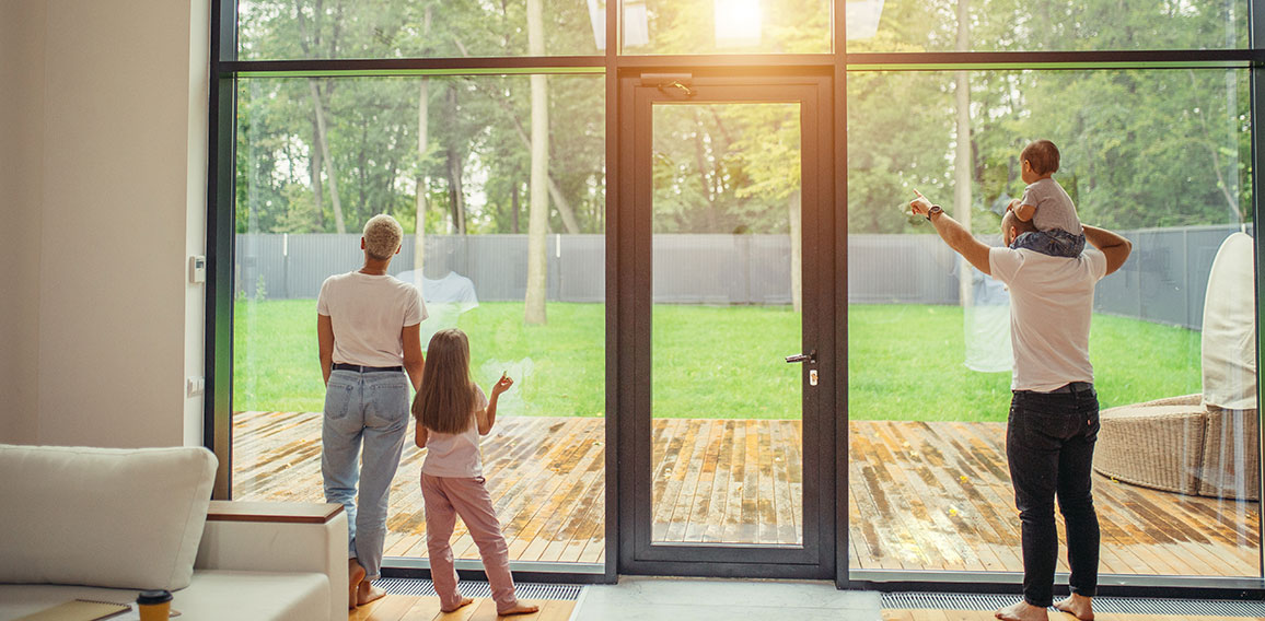 Parents with children near big Panoramic Window garden View