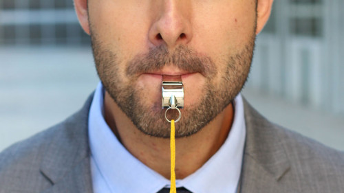Businessman blowing a white isolated