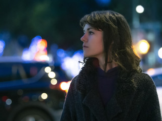 Woman Walking At Night in the City