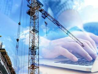 Double exposure of male programmer using laptop and construction